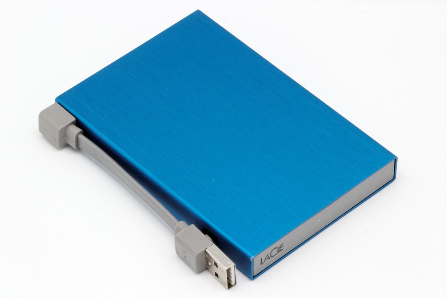 A portable external USB hard drive with its cable